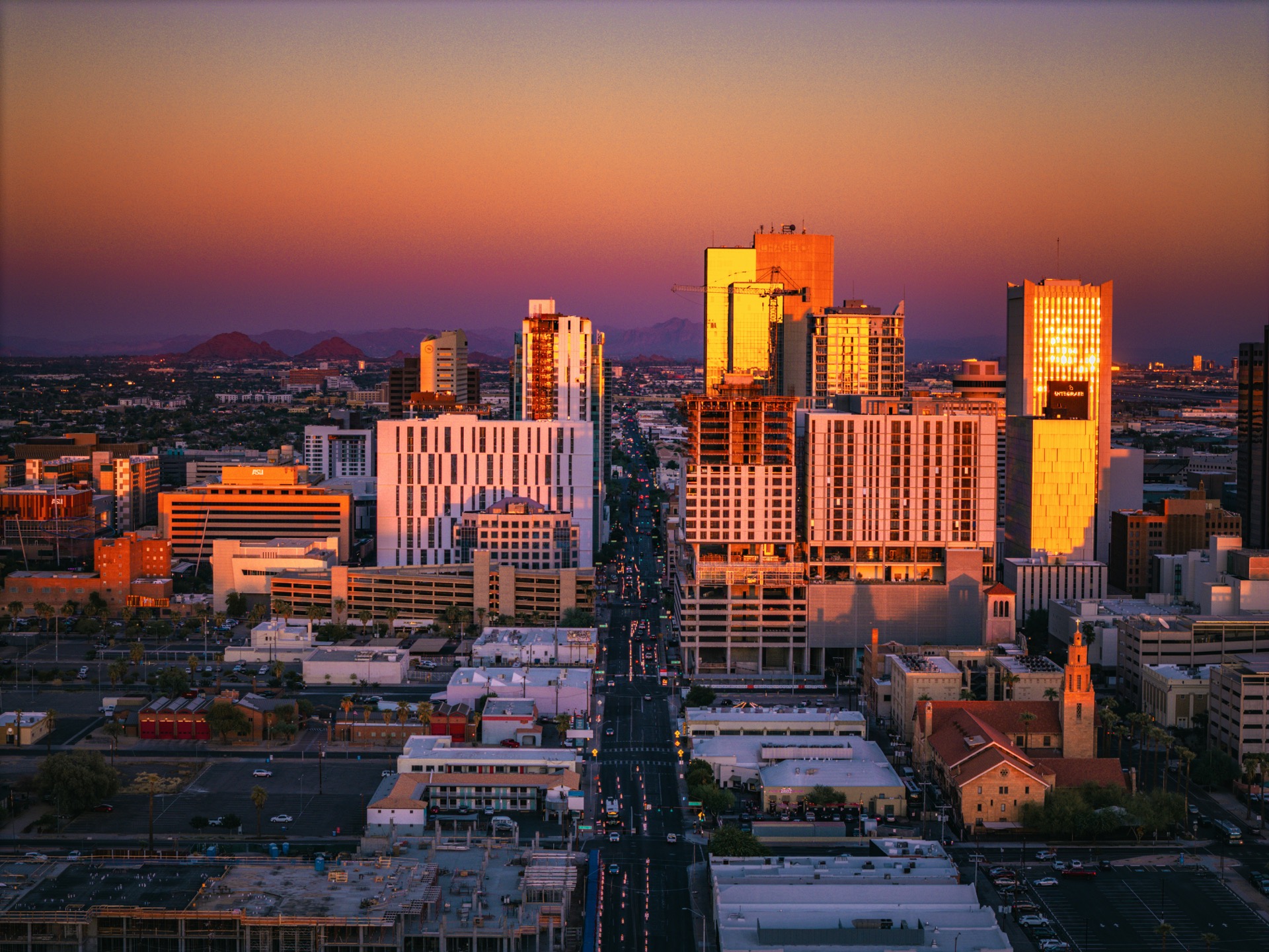 Phoenix Arizona downtown skyline at sunset with Camelback Mountain in the background